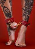 Red ankle cuffs